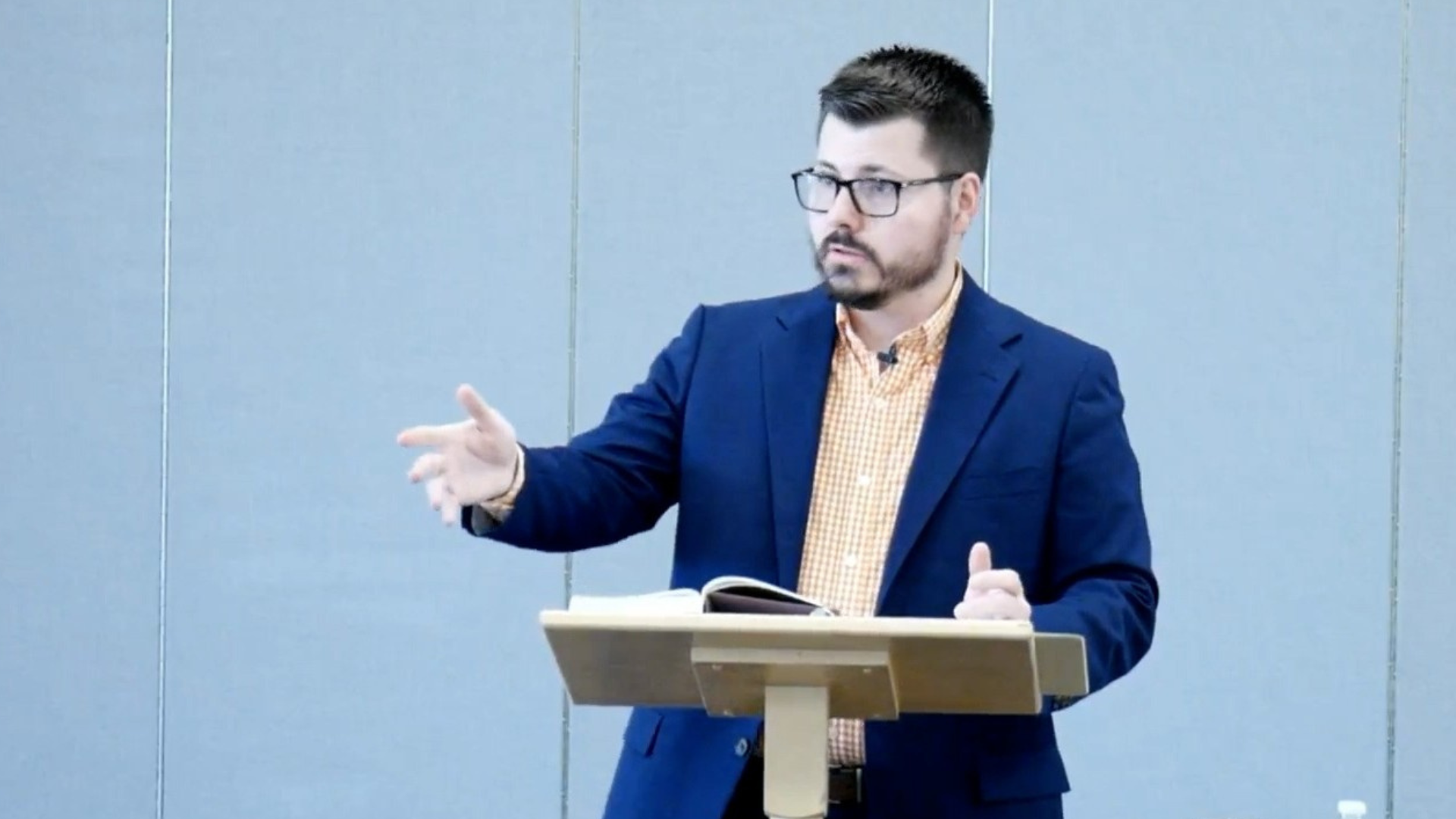 person standing while reading book