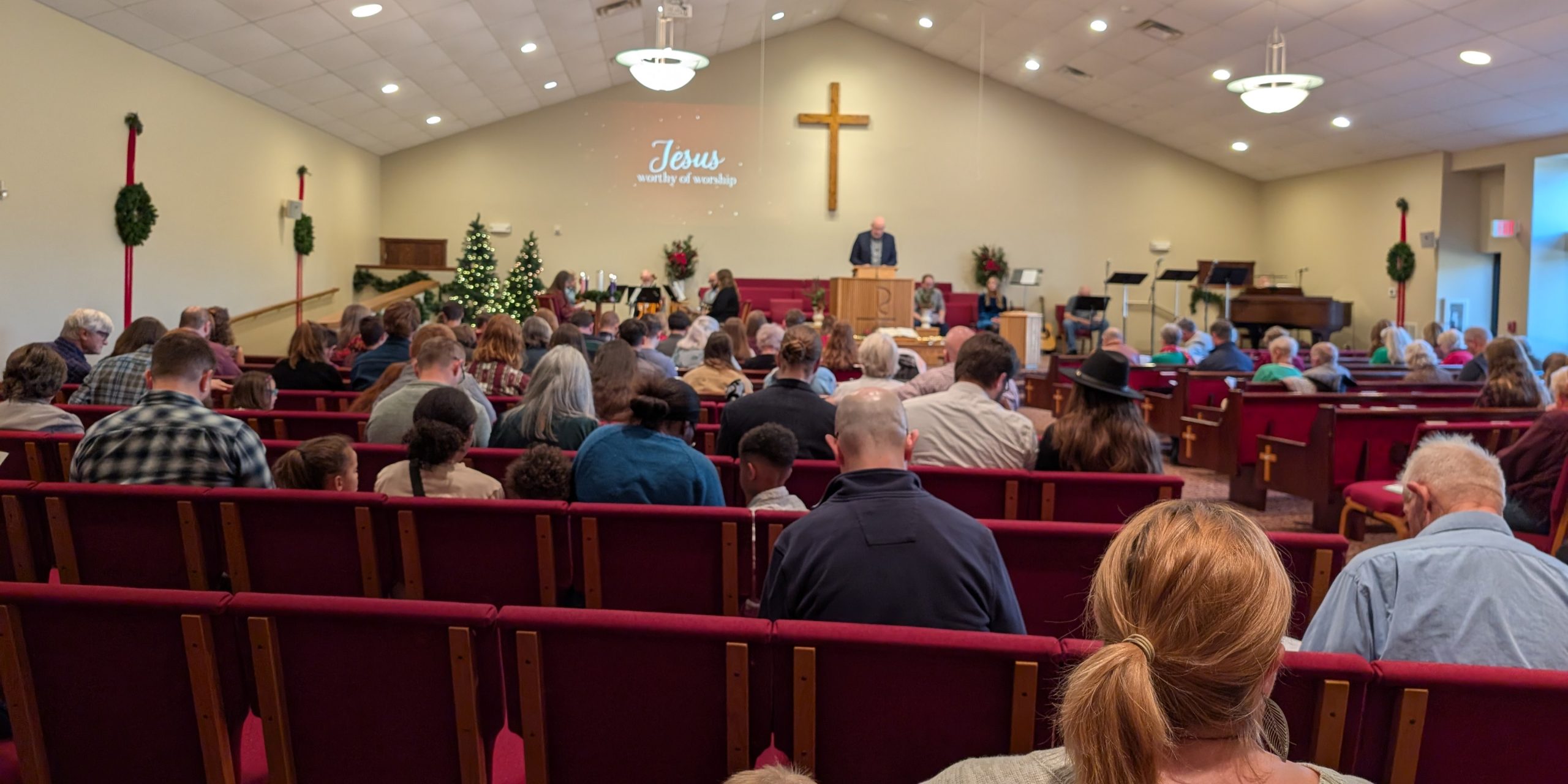 two man and woman standing on doorway